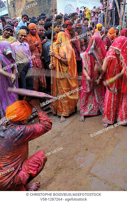 India, Uttar Pradesh, Holi festival, Colour and spring festival celebrating the love between Krishna and Radha  Celebration of Lathmar Holi : On this particular...