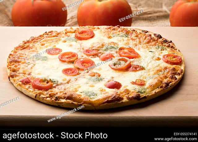 Pizza Caprese, Pizza is a baked flat bread, usually round in shape, made with wheat flour, salt, water and yeast, covered with tomato sauce and cheese