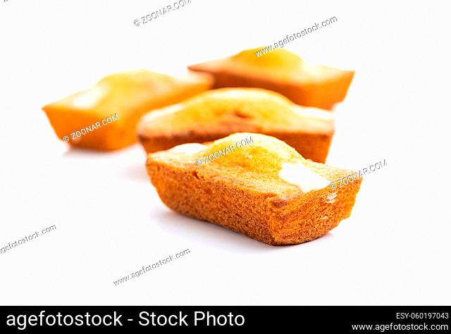 Mini sponge cakes. Sweet vanilla dessert isolated on white background