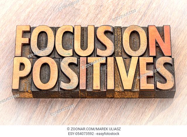 focus on positives - word abstract in vintage lettepress wood type printing blocks