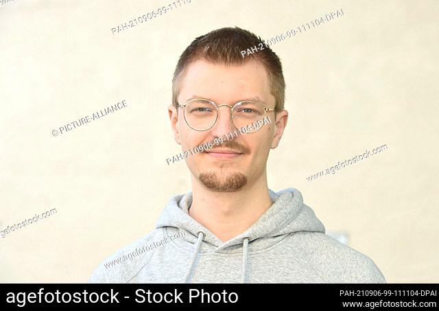 06 September 2021, Bavaria, Munich: Jonathan Kolb (BUNDjugend) stands in the courtyard of the One World House Munich at the press day before the start of the...