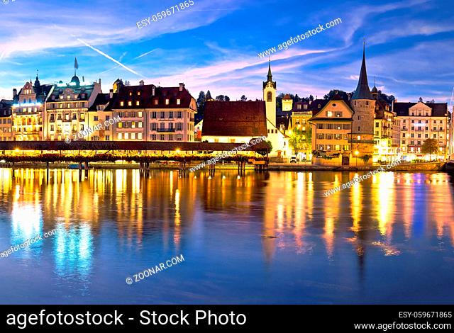 Luzern Kapelbrucke and riverfront architecture famous Swiss landmarks evening view, famous landmarks of Switzerland