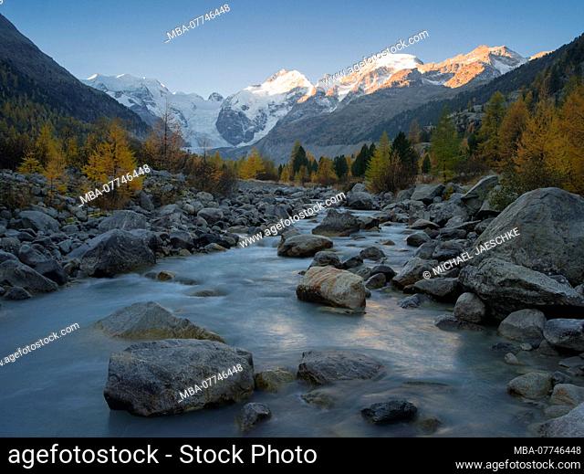 Mountains in the morning light about glacier river, Morteratsch valley in autumn, Canton of Grisons, Switzerland