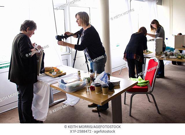 People setting up their items in a food photography class organised by the Department of Education and Lifelong Learning, Aberystwyth University, Wales UK