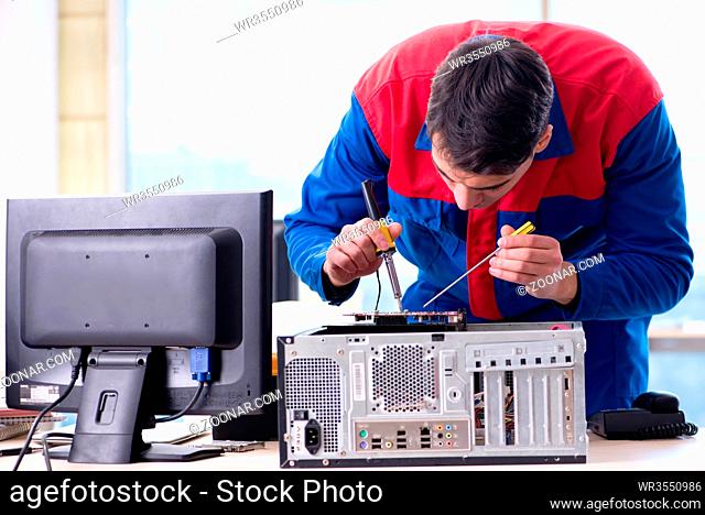 Computer repairman specialist repairing computer desktop
