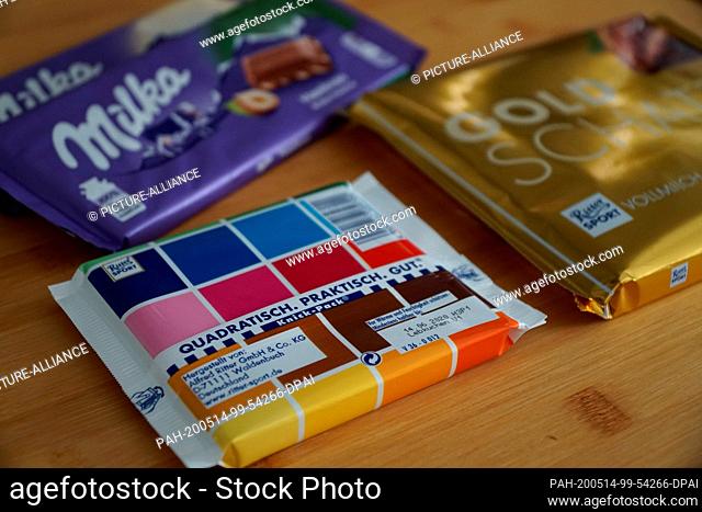 ILLUSTRATION - 14 May 2020, Berlin: Chocolate bars of the brands Ritter Sport and Milka are placed on a table. (scene posed) (to dpa ""Milka disputes Ritter...