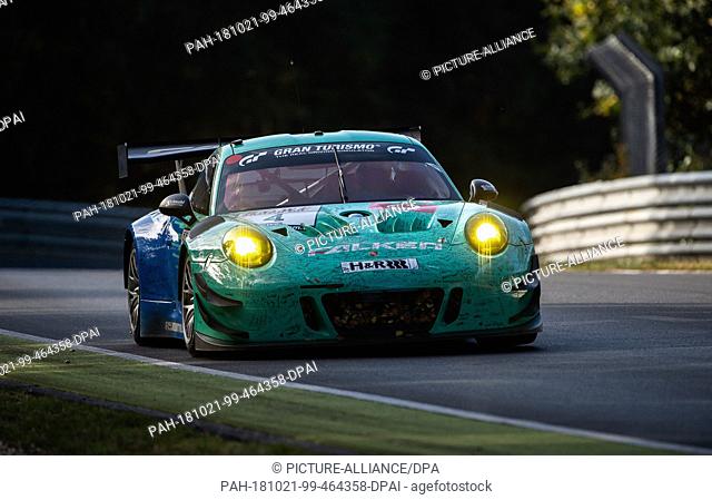 20 October 2018, Rhineland-Palatinate, Nuerburg: The Porsche 911 GT3 R with Klaus Bachler and Martin Ragginger from Team Falken Motorsports drives at the 43rd...