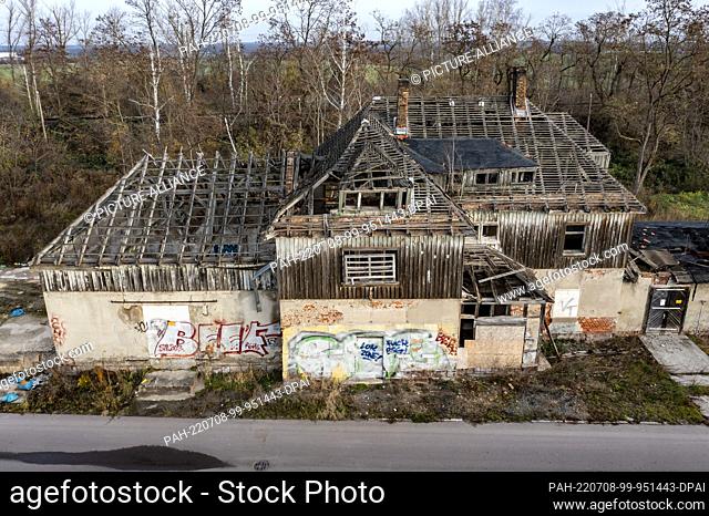23 November 2021, Saxony, Espenhain: The old train station is marked by vandalism. For decades, the site was symptomatic of the pollution caused by the lignite...