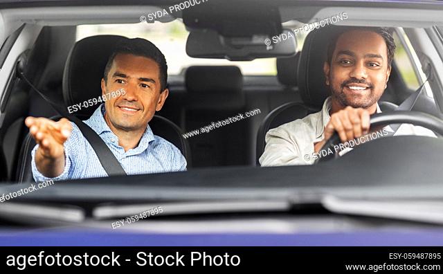 car driving school instructor teaching male driver