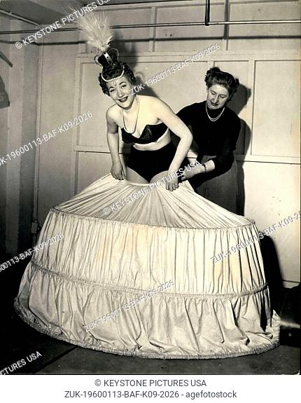 Mar. 31, 2012 - With the help of the Wardrobe Mistress, Jo Anne Lee, pulls up the wired underskirt which is the foundation for her beautiful Queen Elizabeth...