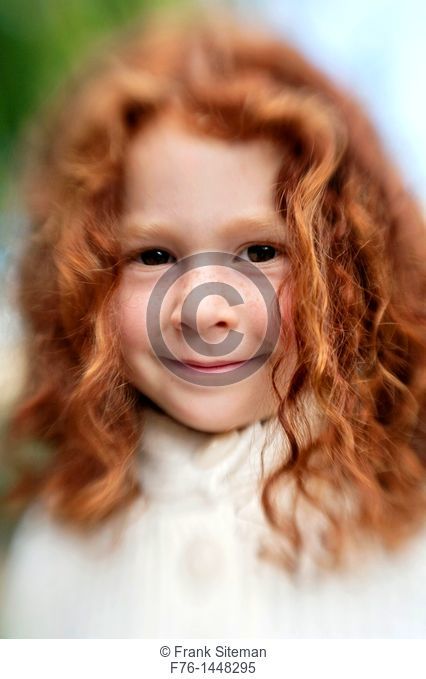 Portrait of 5 year old girl with red hair, shot with lensbaby for blur and distortion