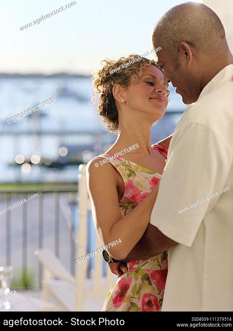 Middle-aged couple dancing outdoors