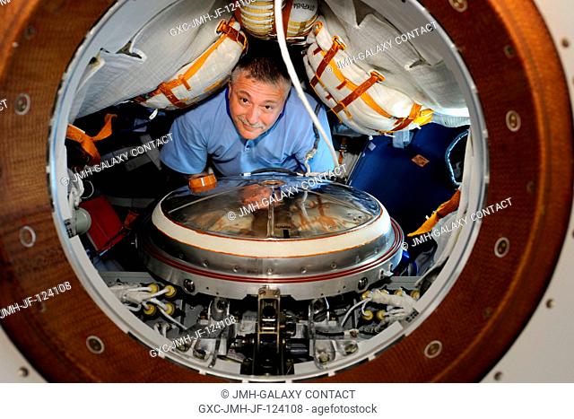 Russian cosmonaut Fyodor Yurchikhin, Expedition 24 flight engineer, works in Soyuz TMA-19 spacecraft while docked to the Zvezda Service Module's aft port of the...