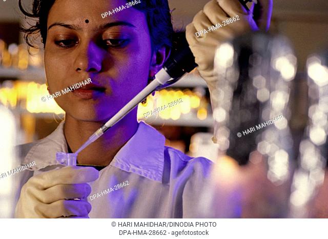Lab technicians doing research ; reserch and development ; India