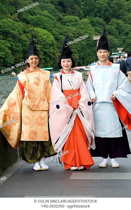 Hozu River; Arashiyama; Kyoto; Japan; Fune Matsuri; Boat Festival, Lady and two men in costumes of Heian Period Court, Japanese traditions, Ceremonial dress