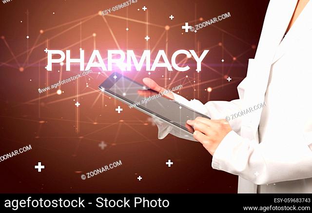 Doctor fills out medical record with PHARMACY inscription, medical concept