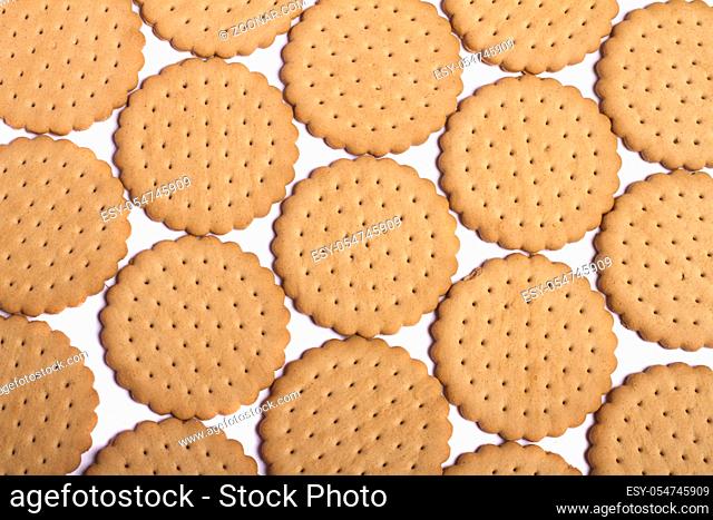 View of many round biscuits isolated on a white background