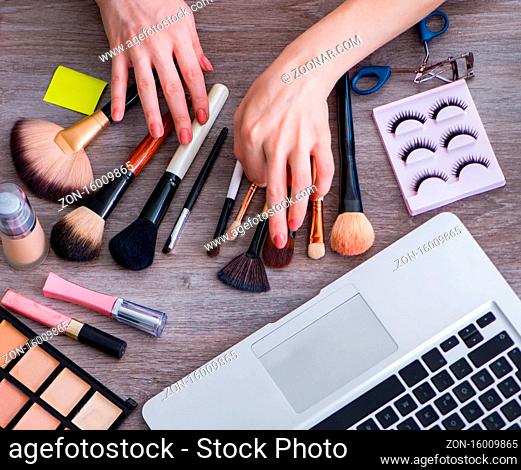 Fashion blogger with make-up accessories