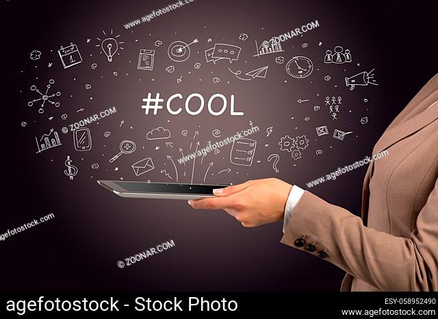 Close-up of a touchscreen with #COOL inscription, social media concept