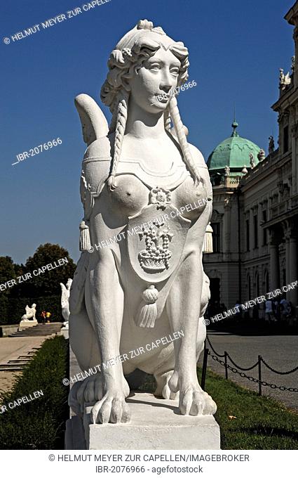 Sculpture of a sphinx against a blue sky at the Oberes Schloss Belvedere palace, Prinz-Eugen-Strasse street 27, Vienna, Austria, Europe