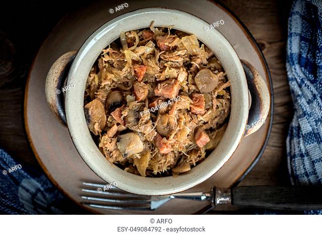 Traditional polish sauerkraut (bigos) with mushrooms and meat. Shallow depth of field