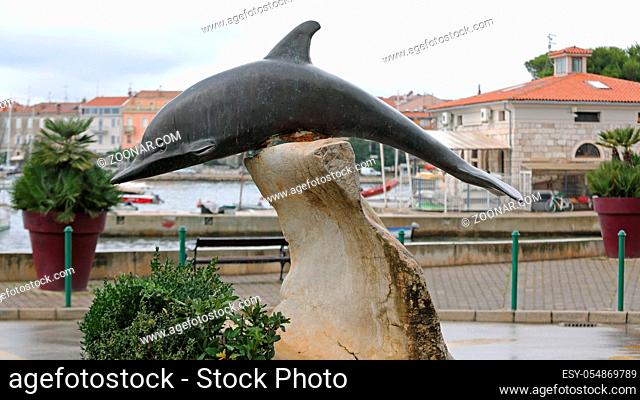 Rovinj, Croatia - October 15, 2014: Bronze Sculpture of Dolphin Monument in Rovinj, Croatia