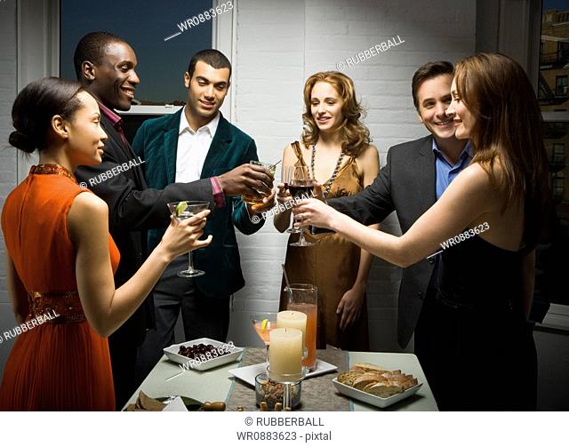 Group of people toasting at a party
