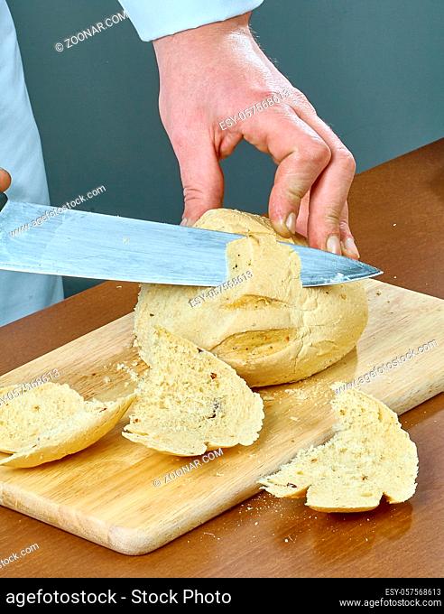 Cook cuts bread for cooking stuffed fish collection of culinary recipes