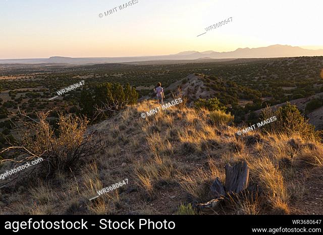 Young boy overlooking Galisteo Basin, Santa Fe, NM