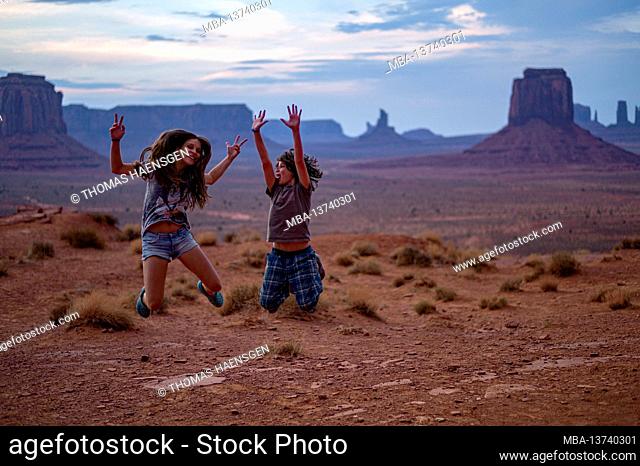 Boy and girl are happy because of the great classic view of Monument Valley from Artist Point. Monument Valley Navajo Tribal Park, Utah and Arizona