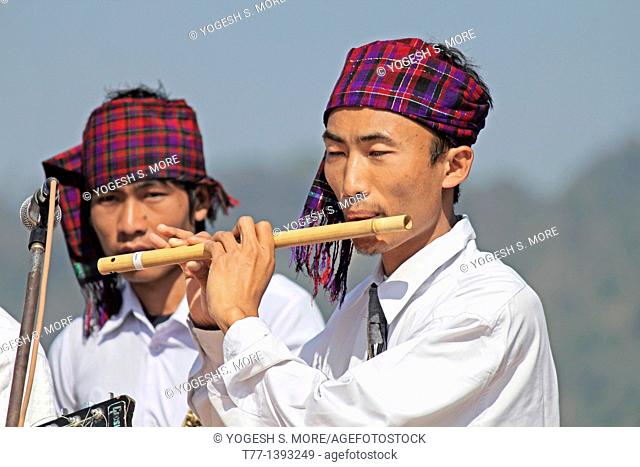 Singpho Man Playing Flute at Namdapha Eco Cultural Festival, Miao, Arunachal Pradesh, India