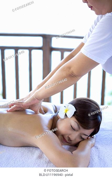 Young woman getting a massage, Saipan