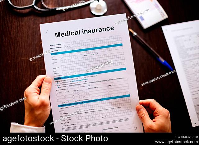 health insurance application. Stethoscope and health medical form. claim form. Male doctor