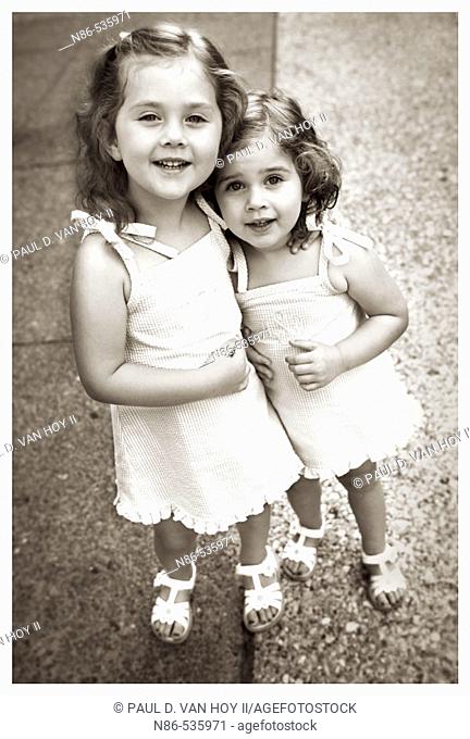 Two little girls embracing