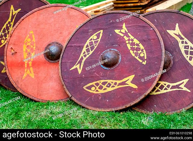 set of traditional wooden shields, round red patterned fish, disposable for ostentatious fights