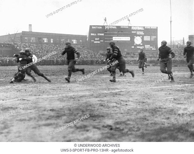 Chicago, Illinois: November 27, 1925. Rookie Red Grange getting tackled at Cub's Park (later Wrigley Field) in his first professional game for the Chicago Bears
