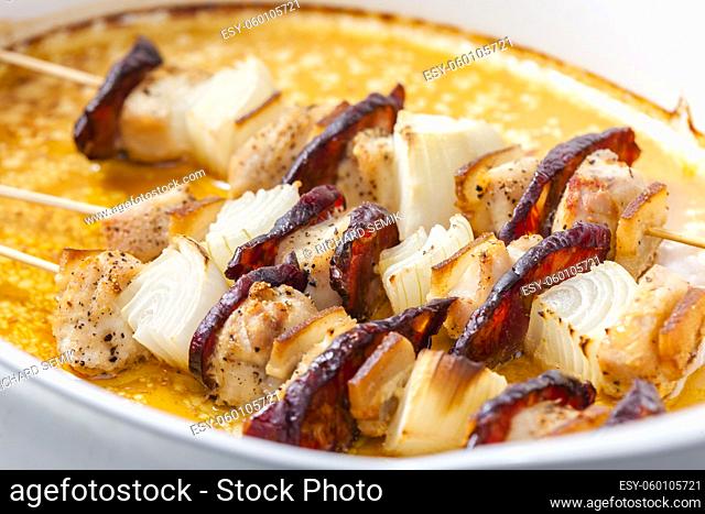 skewers with meat, bacon and onion