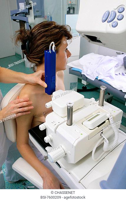 Model and health professional.Photo essay at Rouen University Hospital. Mammogram. Device of digital stereotaxic for mammary biopsies macrobiopsy and...