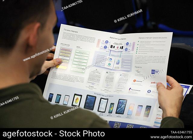 RUSSIA, NOVOSIBIRSK - OCTOBER 17, 2023: A man reads a manual as Open Mobile Platform lets users beta test the Russian-made Aurora OS at the Novosibirsk branch...