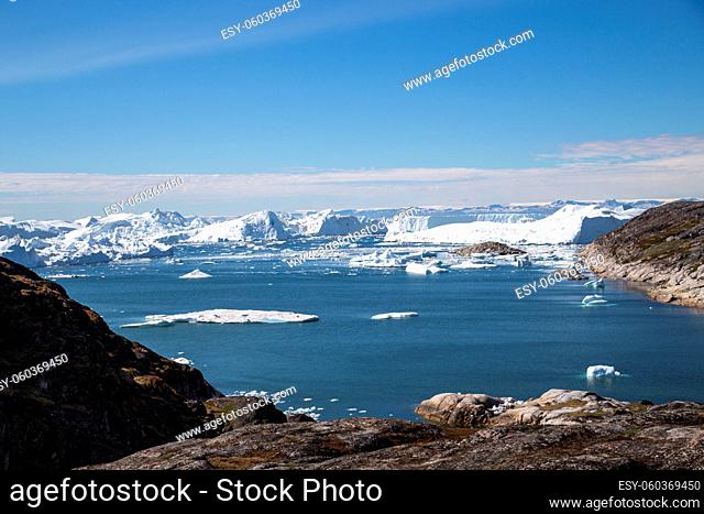 Ilulissat, Greenland - June 30, 2018: The Ilulissat Icefjord seen from the viewpoint. Ilulissat Icefjord was declared a UNESCO World Heritage Site in 2004