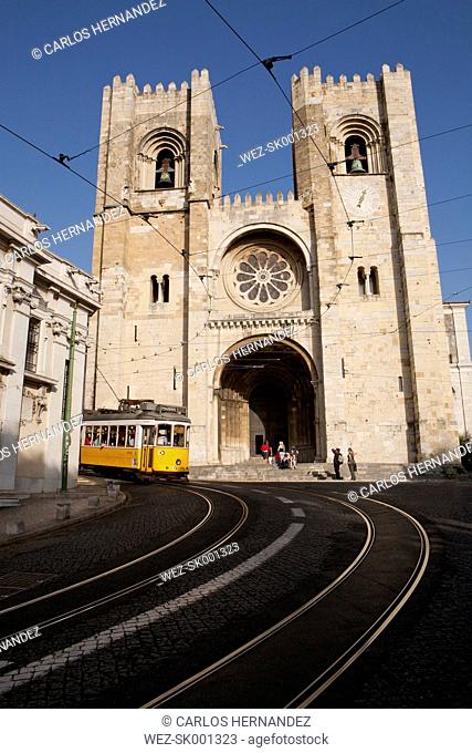 Portugal, Lisbon, Tramway passing by Lisbon Cathedral
