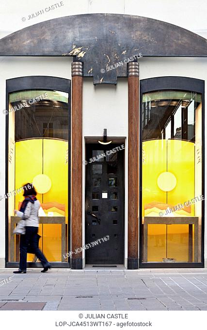 Austria, Lower Austria and Burgenland, Vienna. A young woman looks in the window of the luxury Schullin II Jeweller's shop in Vienna