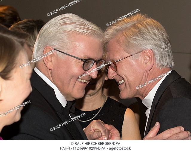 Federal President Frank-Walter Steinmeier and his wife Elke Buedenbender (L) converse with council chairman of the Protestant Church in Germany