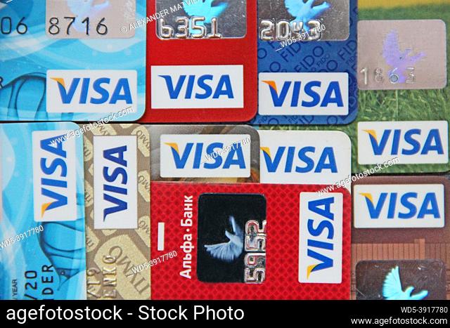 different credit cards with Mastercard brand logo. Close up of many Mastercard credit cards. Plastic bank cards of Mastercard