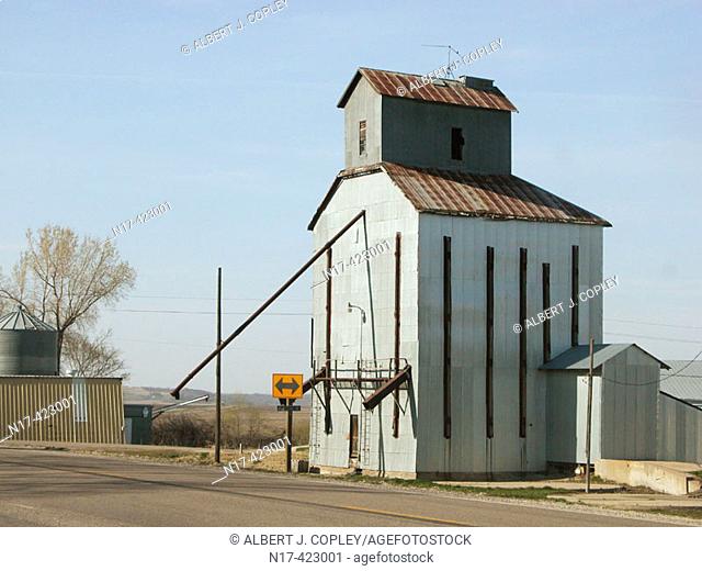 Old grain elevator at railroad, midwestern United States