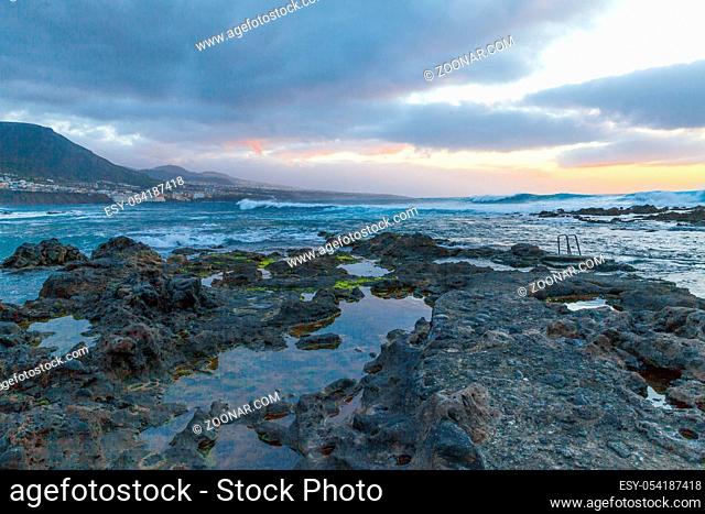 Punta del Hidalgo rock beach at sunset panoramic view Bajamar village Tenerife island