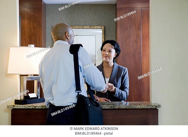 African businessman at hotel check-in