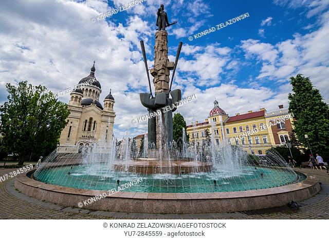 Avram Iancu statue and fountain and Romanian Orthodox Cathedral of Dormition of the Theotokos on Avram Iancu Square in Cluj Napoca city in Romania
