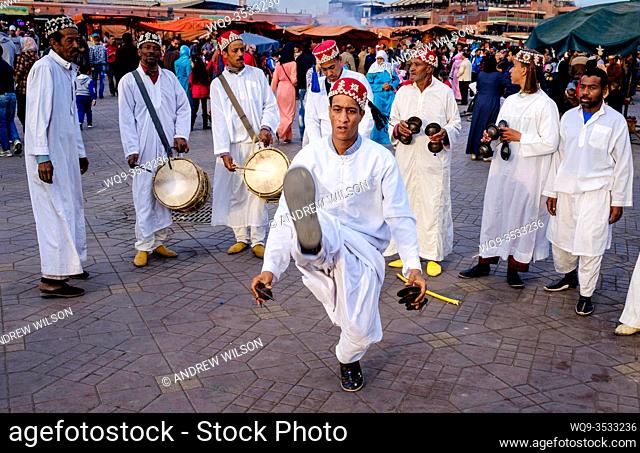 Men playing drums and performing a traditional dance in the Jemaa el Fna, Marrakech, Morroco, North Africa