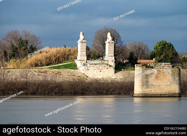 Arles, Provence, France, 1 1 2023 - Banks of the River Rhone and historical monuments against dark clouds